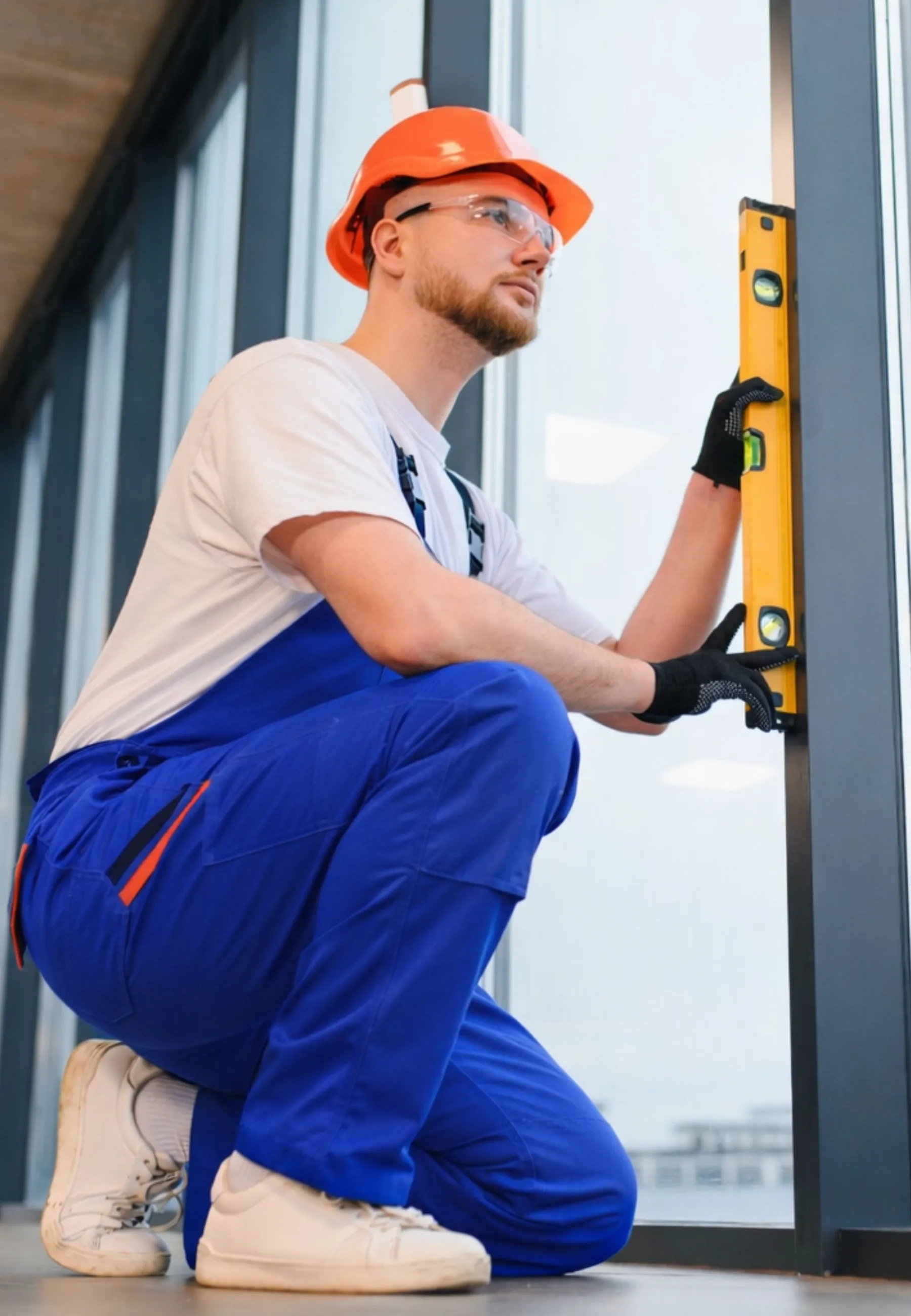 Expert technician from Insta glass dallas performing a precision glass installation using a professional level tool in Dallas, TX.